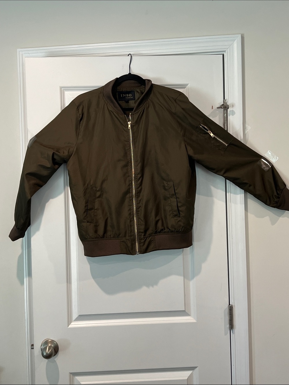 Women’s light weight Olive Bomber Jacket gold zipper finish to left upper arm